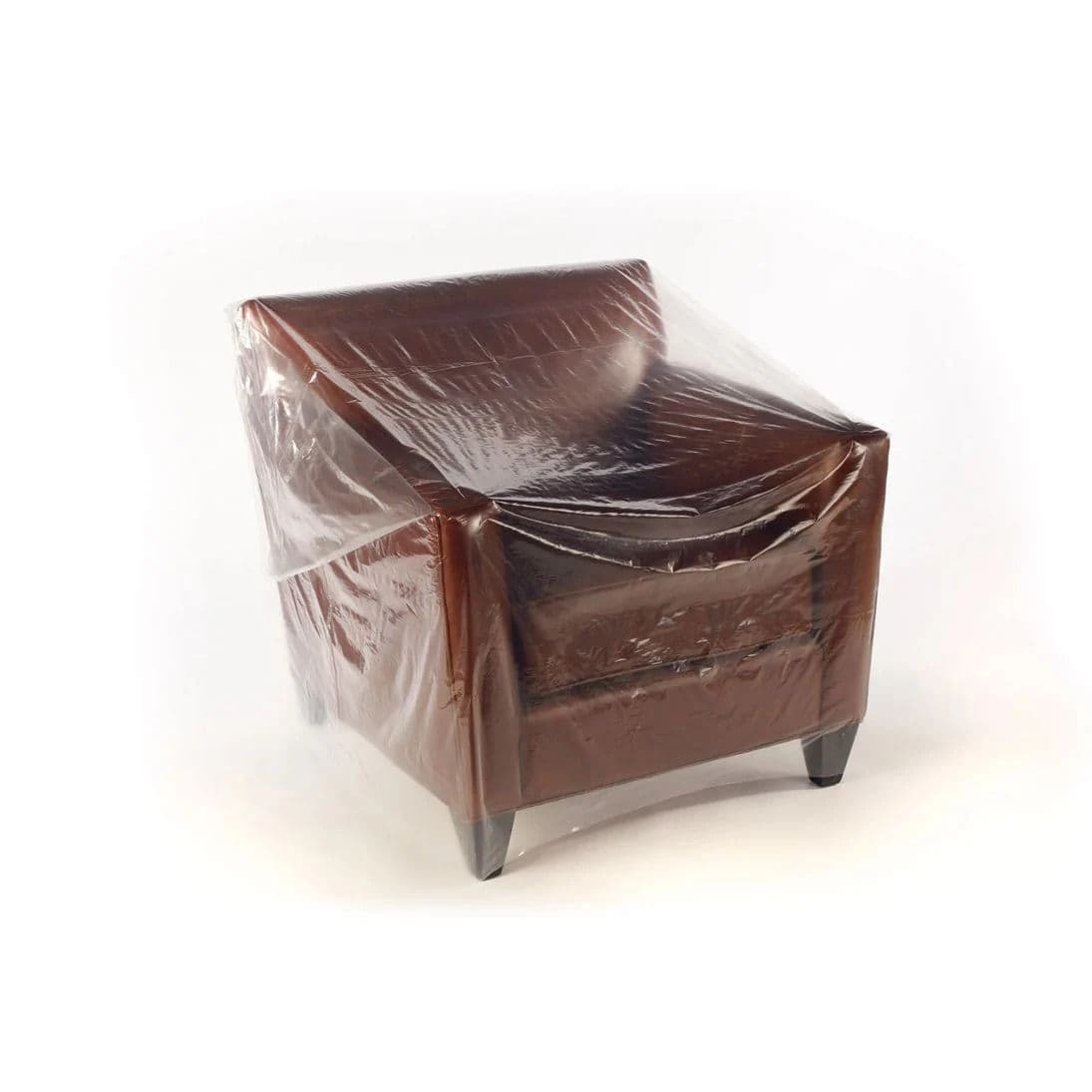 Furniture Bags Heavy-duty clear furniture polythene bags covering a sofa for professional moving and storage UK